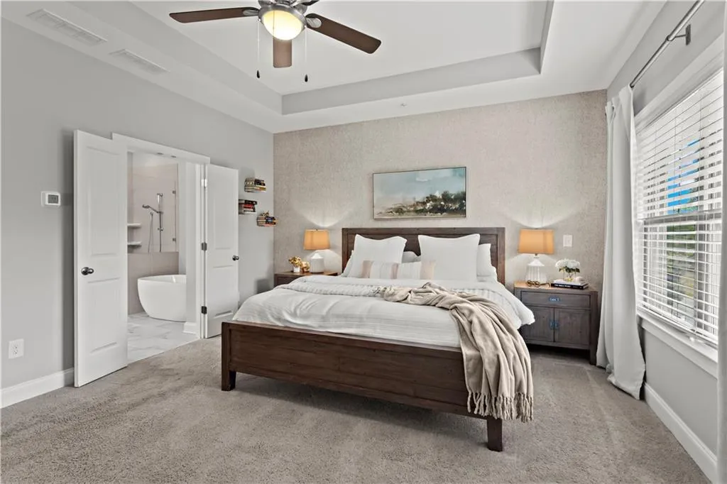 Spacious Primary suite is filled with natural light