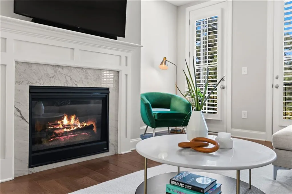 Attention to detail throughout from the gas insert fireplace with the marble surround with the transitional mantel.