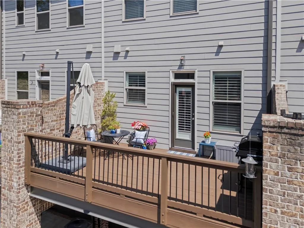 Freshly stained garage offers space for grilling, an eating area and seating space.