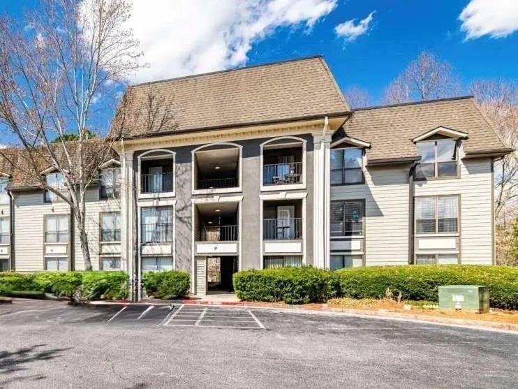 View of property featuring uncovered parking View of property featuring uncovered parking
