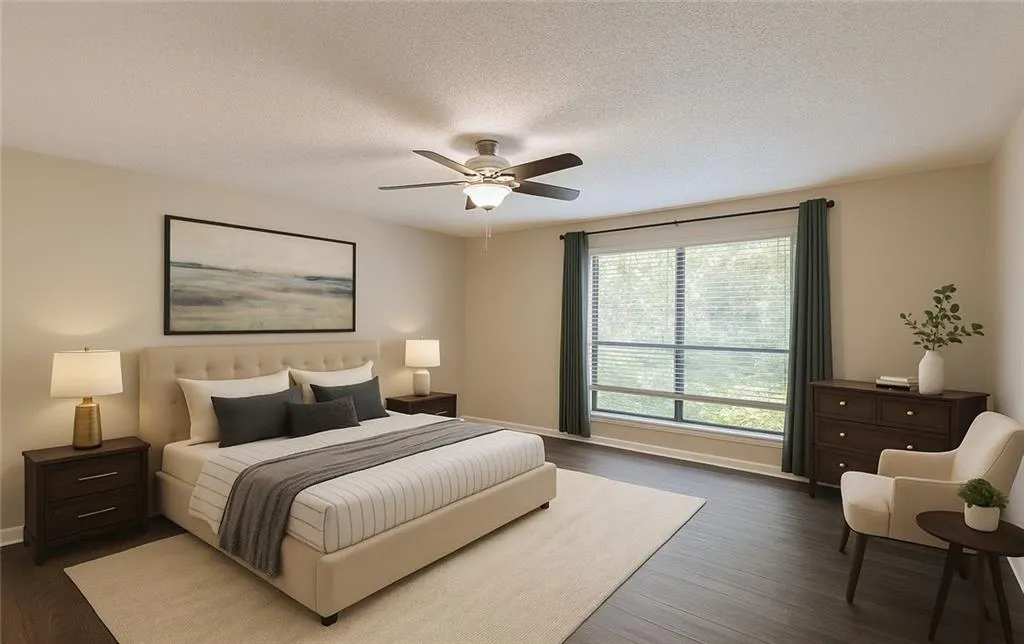Bedroom with ceiling fan, a textured ceiling, and dark wood finished floors Bedroom with ceiling fan, a textured ceiling, and dark wood finished floors