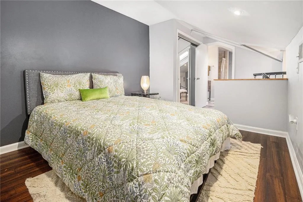 3rd Bedroom with wood finished floors and full bathroom