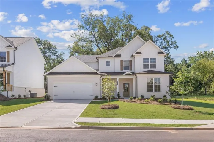 Contemporary exterior design featuring white brick and vertical siding