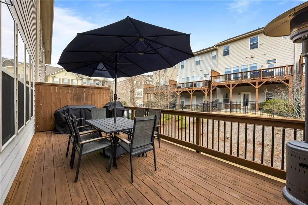 Deck featuring outdoor dining area and grilling area