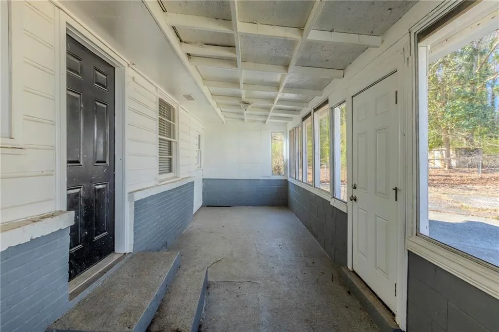 Unfurnished sunroom featuring visible vents
