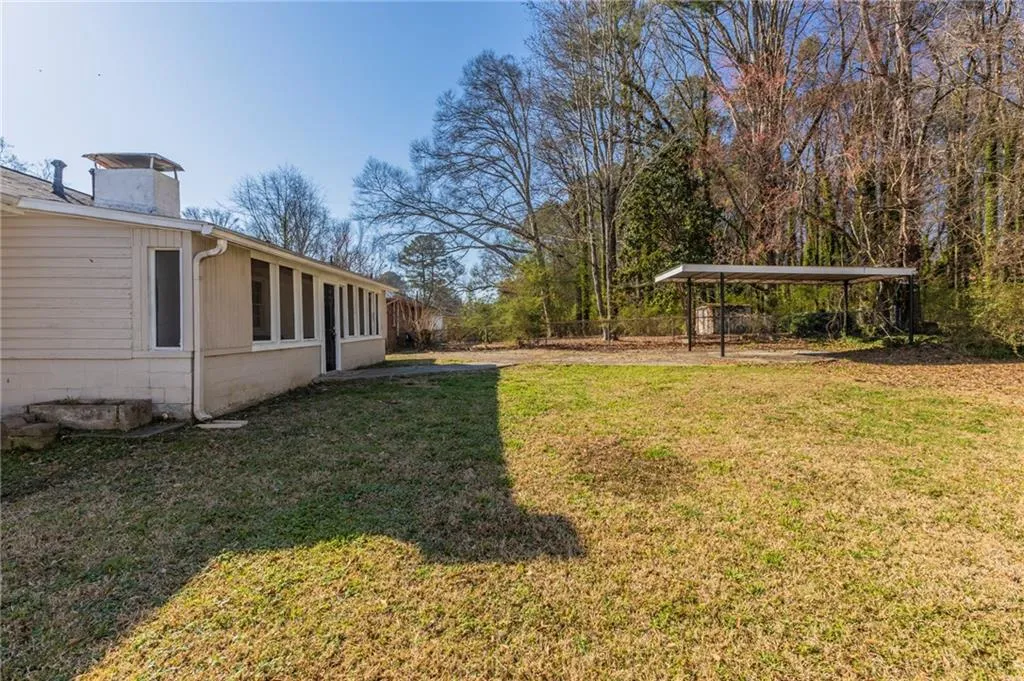 View of yard featuring fence