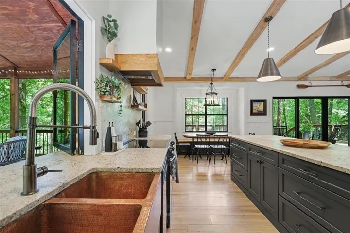 Open kitchen and dining layout with natural light throughout