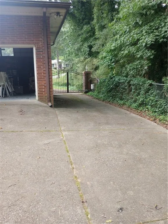 View of gate and garage in rear