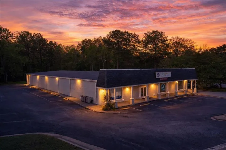 View of property at dusk