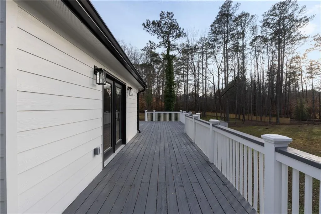Wooden terrace with a yard