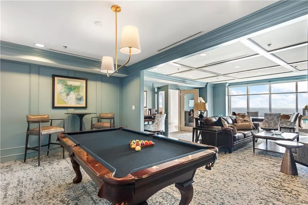 Game room featuring a decorative wall, pool table, healthy amount of natural light, crown molding, and recessed lighting