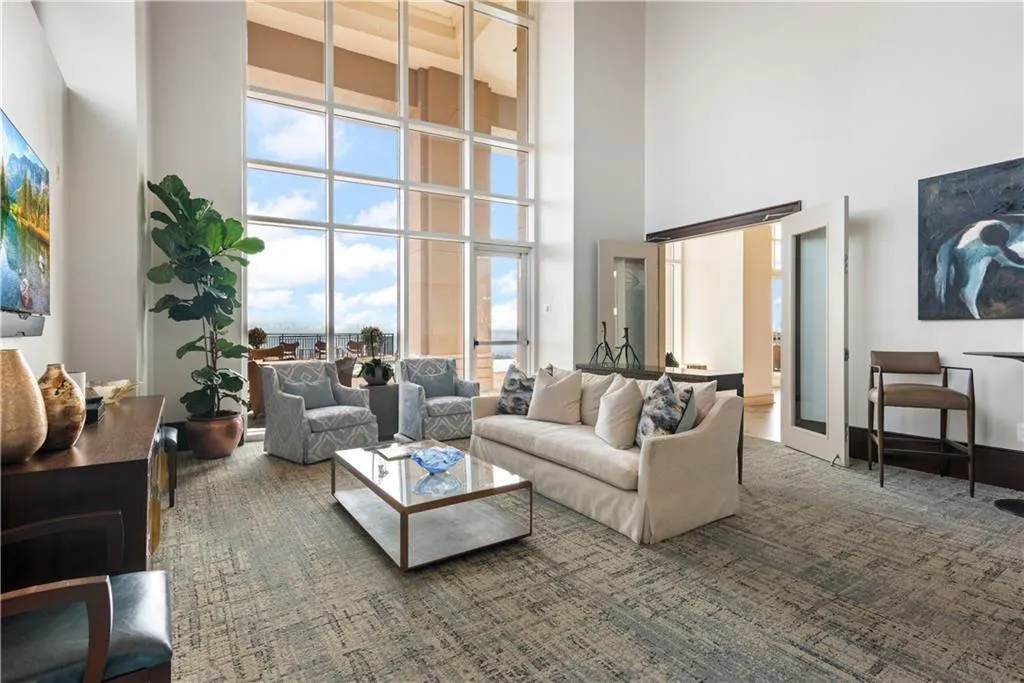 Community room featuring a high ceiling and plenty of natural light