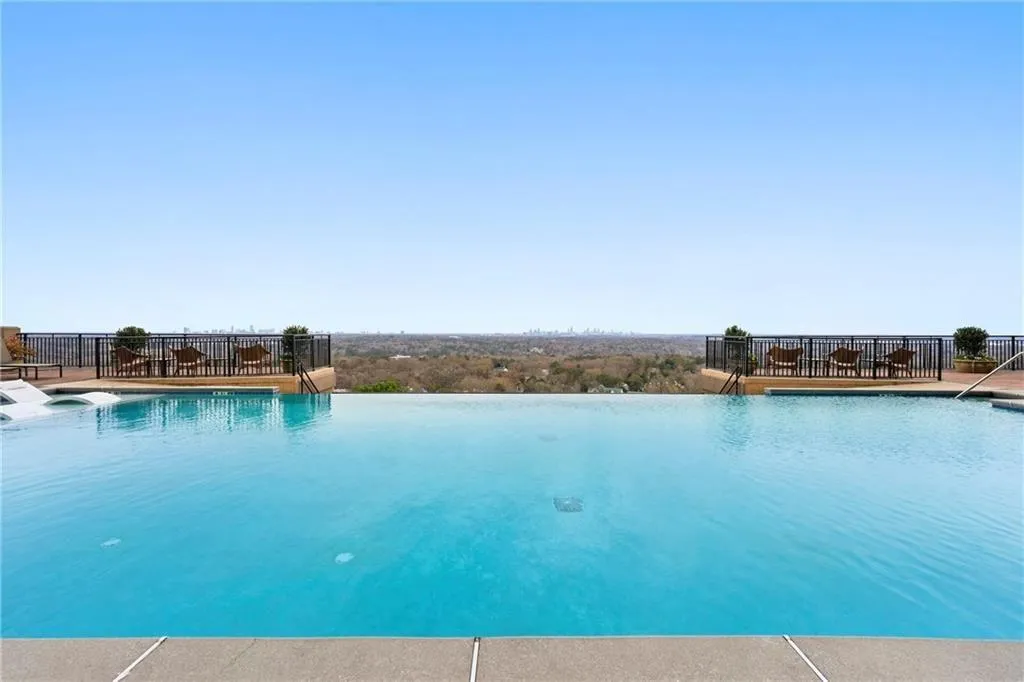 Community pool featuring a patio