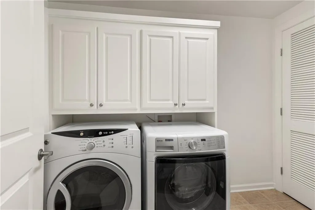 Laundry room with washer and dryer and cabinet space