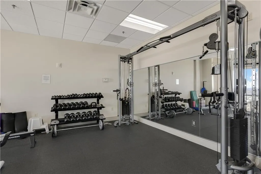 Gym with a paneled ceiling
