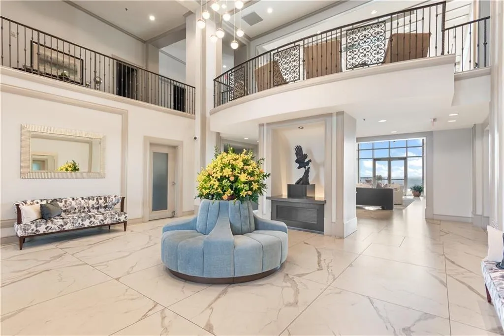 Lobby featuring a high ceiling and recessed lighting