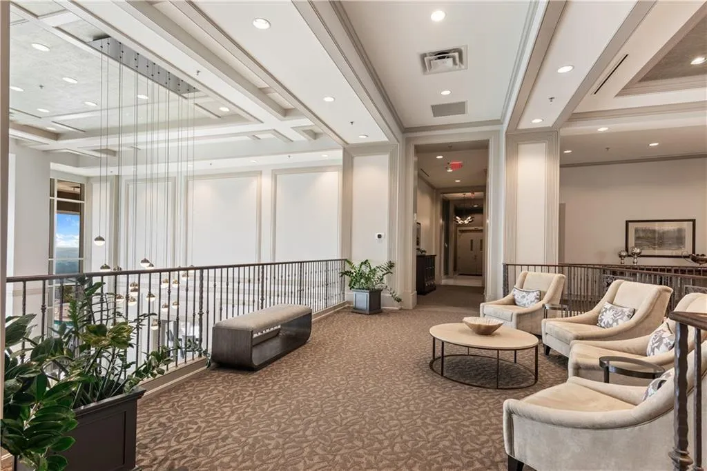 Community lobby with recessed lighting and ornamental molding
