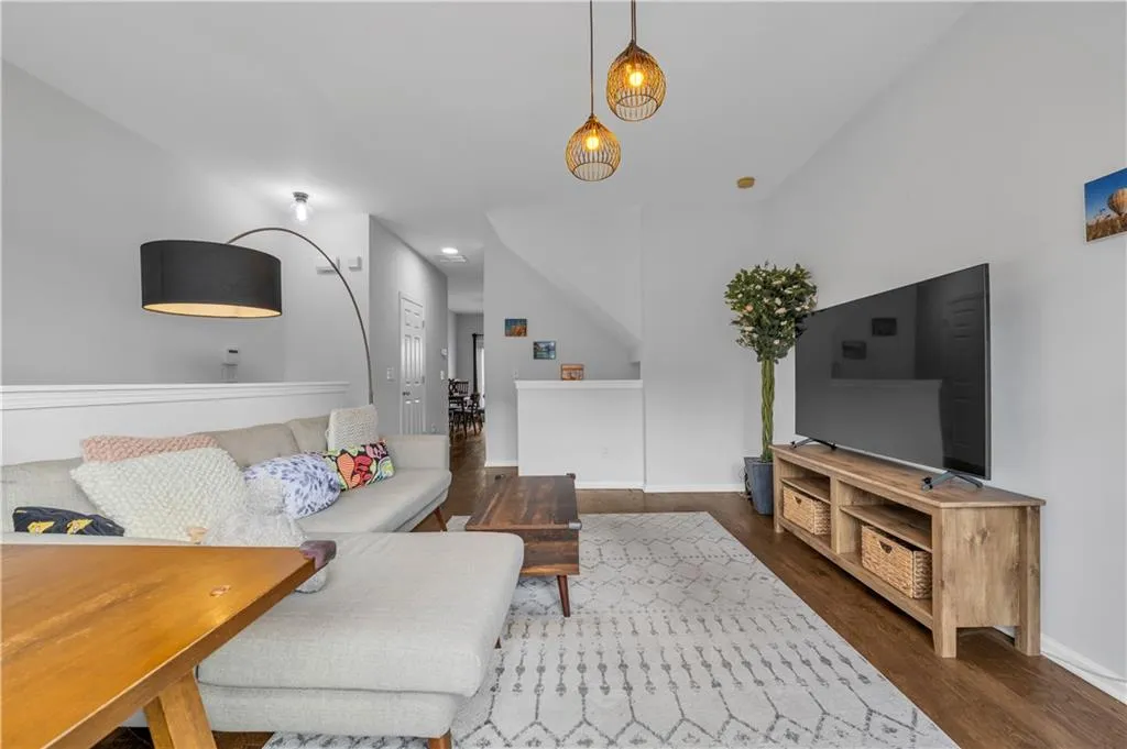 Living area featuring wood finished floors and baseboards