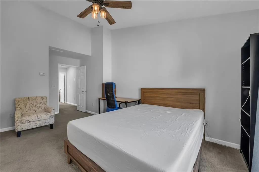 Bedroom featuring carpet floors and ceiling fan