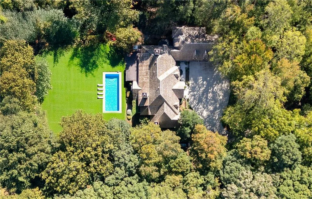 There is ample room to extend the level backyard and add an in-ground pool, as depicted in this conceptual rendering.
