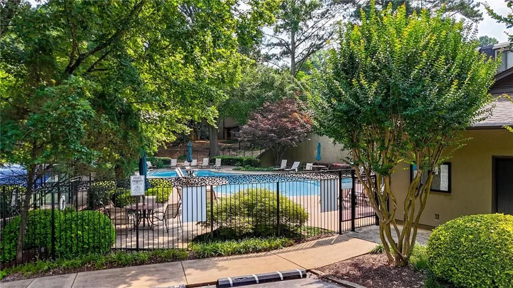Community pool with a patio area