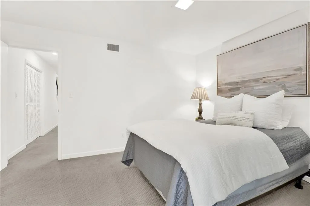 Bedroom with carpet and baseboards