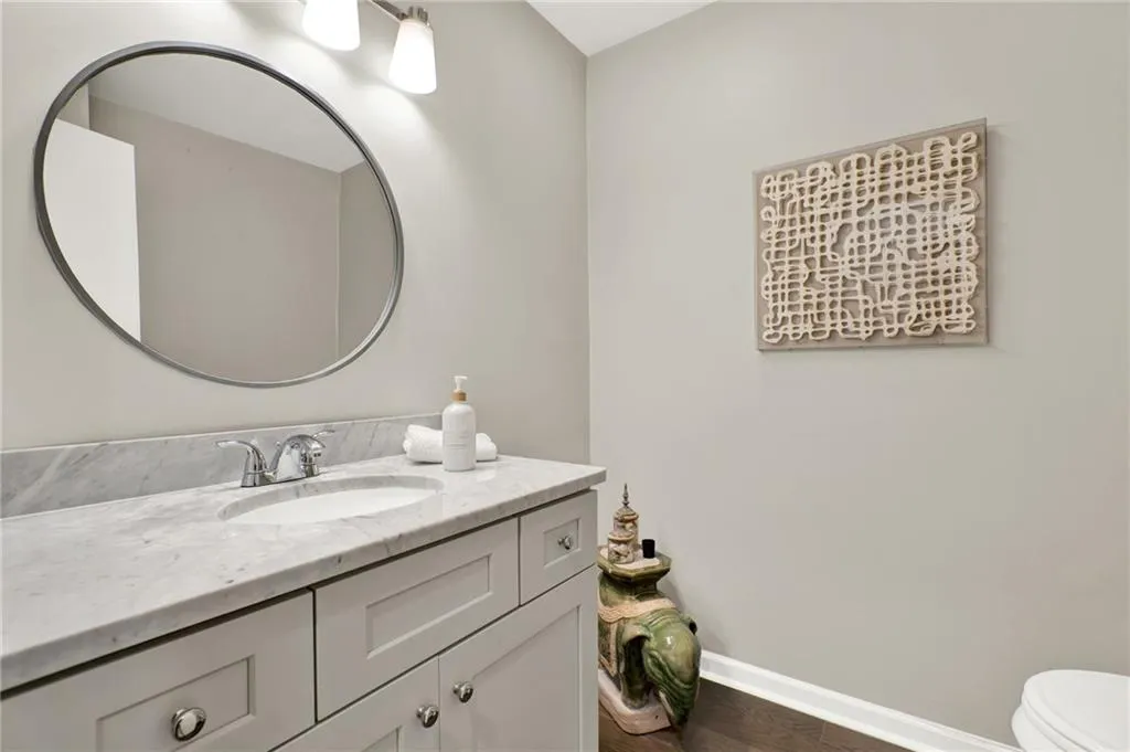 Bathroom with vanity and wood finished floors