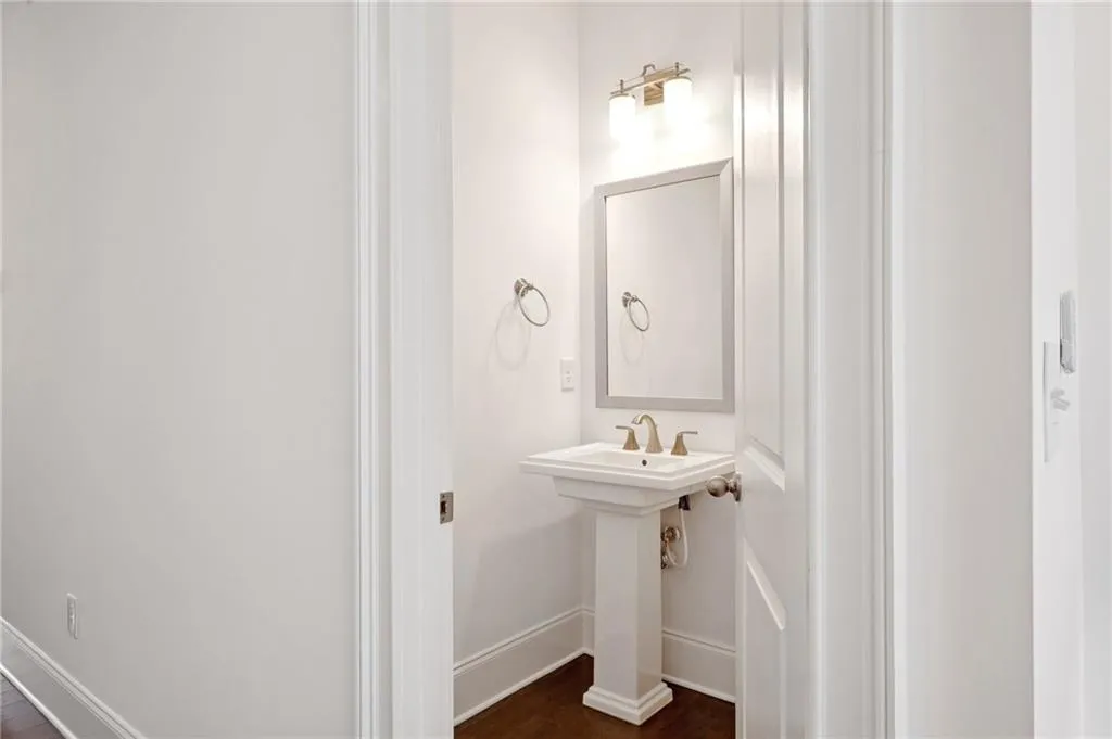 Bathroom with hardwood / wood-style flooring