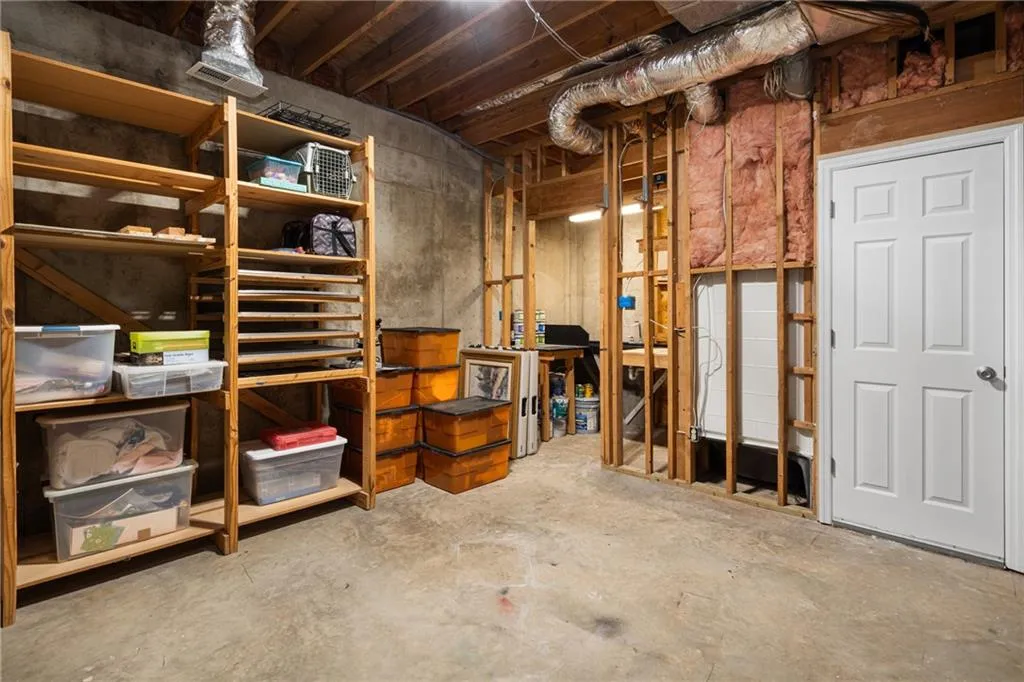 900 Edgewater Drive~ One of three large, unfiinished storage areas in the basement. This one has a dark room/photography area and an amazing flex space for hobbies or creative work.