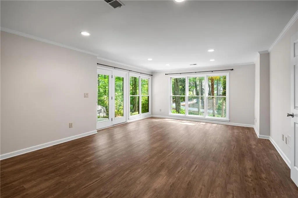 900 Edgewater Drive~ The Terrace level offers about 1445 square feet of finished space- all recently refinished with LVP flooring, new paint and carpet. This large room could serve as a family room, a nanny or teen suite.