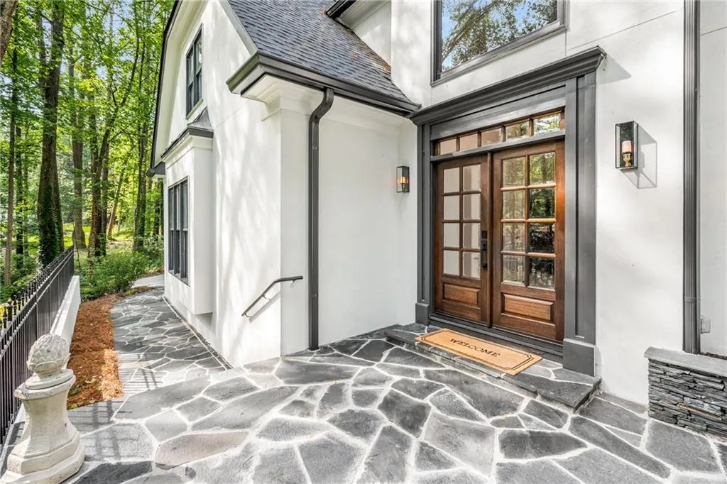 900 Edgewater Drive~ Brand new front doors completed the recent exterior refresh which included new exterior paint, new roof, and new gutters.