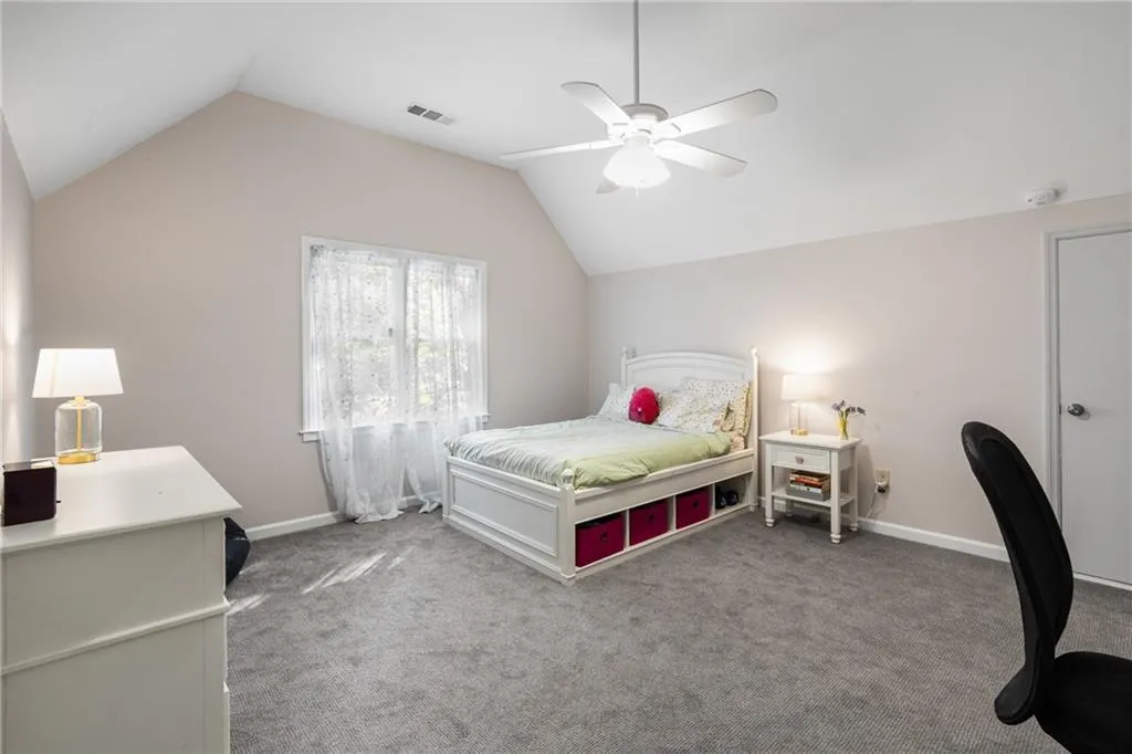 900 Edgewater Drive~ The third secondary bedroom features angled ceilings, a huge walk-in closet and has its own full bathroom.