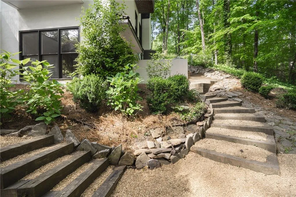 View of side yard... pebbled staircase