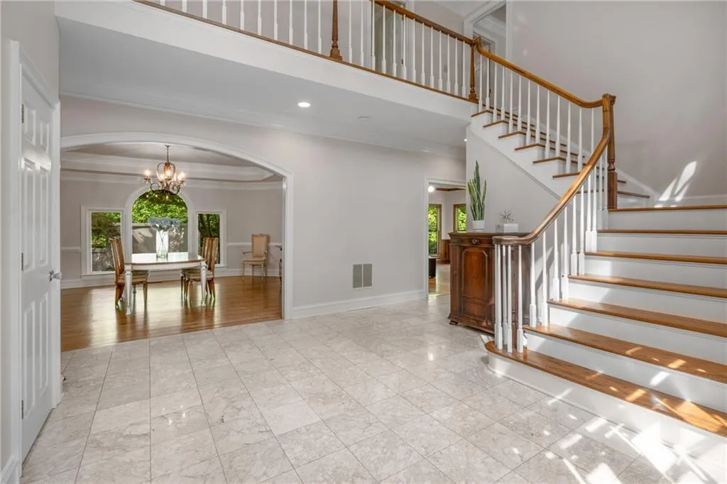 900 Edgewater Drive~  From the moment you step inside, natural light and gracious design set the tone. Entertain with ease i the generously sized Dining Room just off the Foyer.