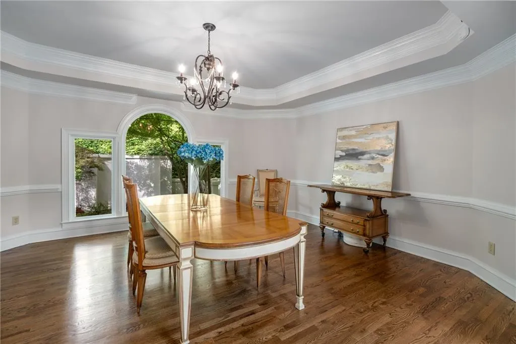 900 Edgewater Drive~ For more formal entertaining, and at the heart of the home, is the generously-sized and welcoming Dining Room, which is also the center of the main level of the home. Enjoy views of the private backyard and the Front Entry.