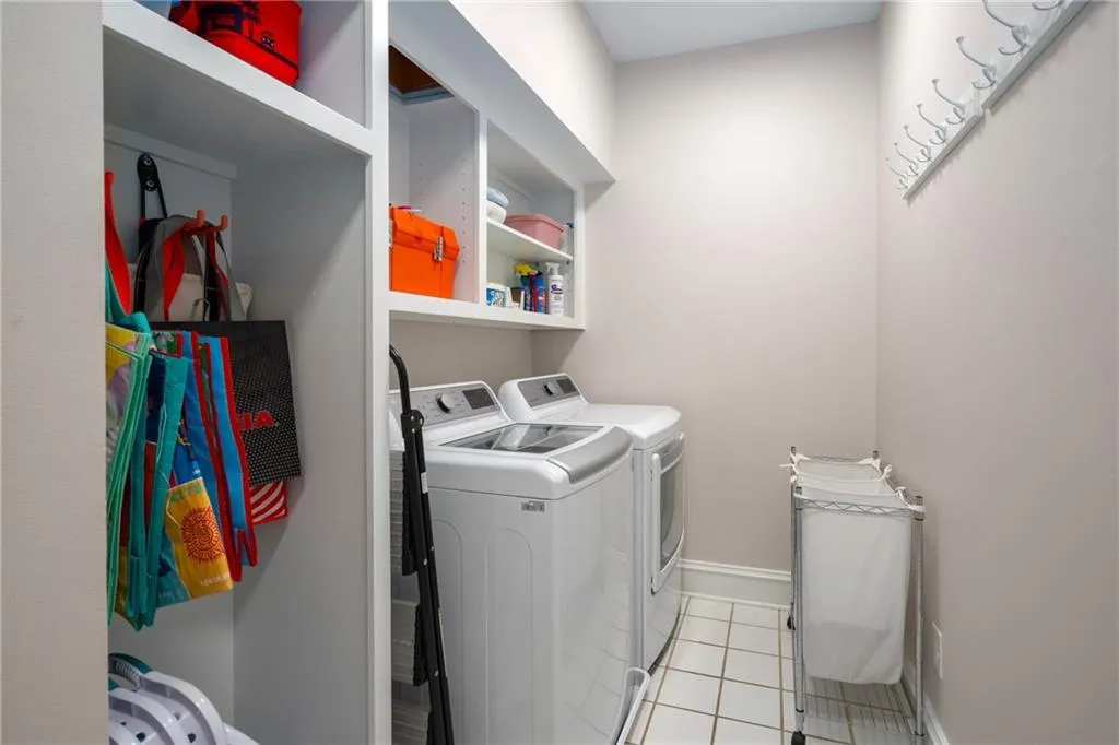 900 Edgewater Drive~ Large Laundry on the Main Level of the home features useful built is and helpful hooks!