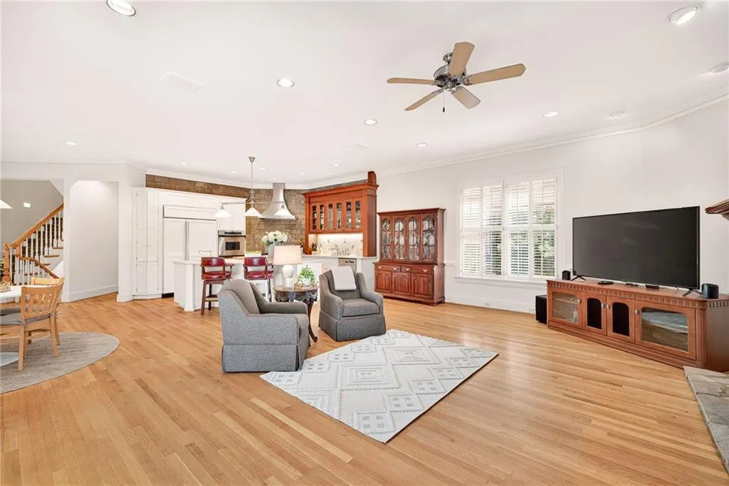 Secondary view of living room with view of kitchen