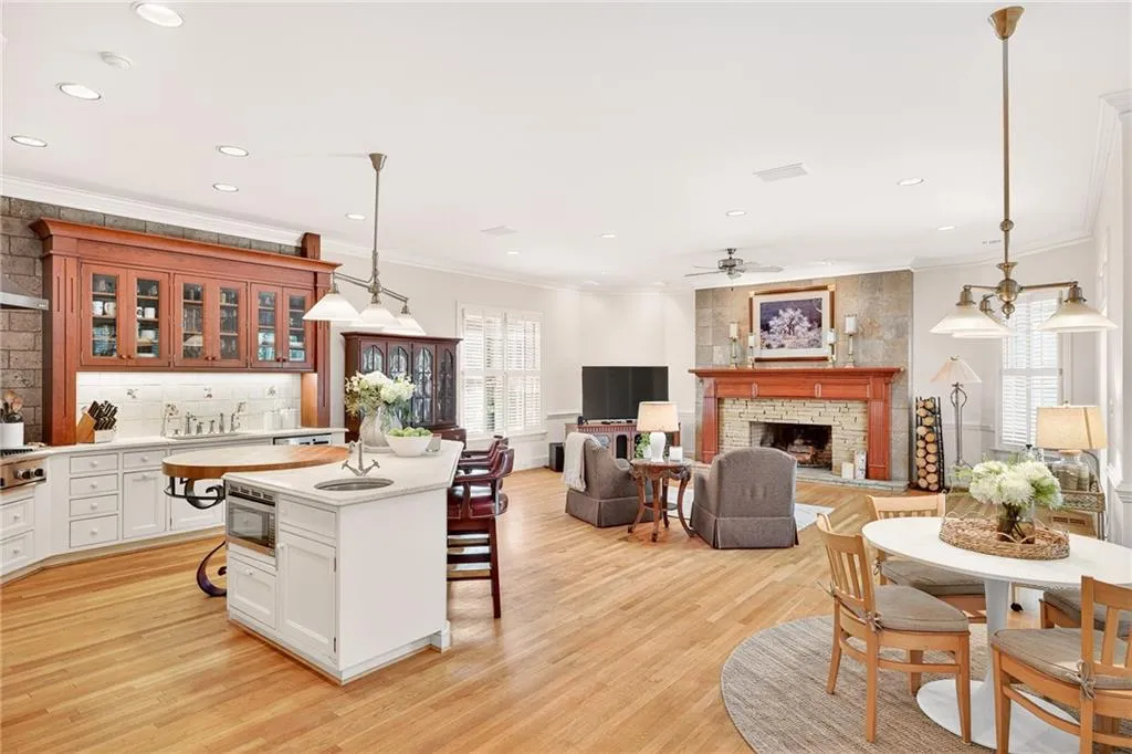 Kitchen opens to view of living room and breakfast area