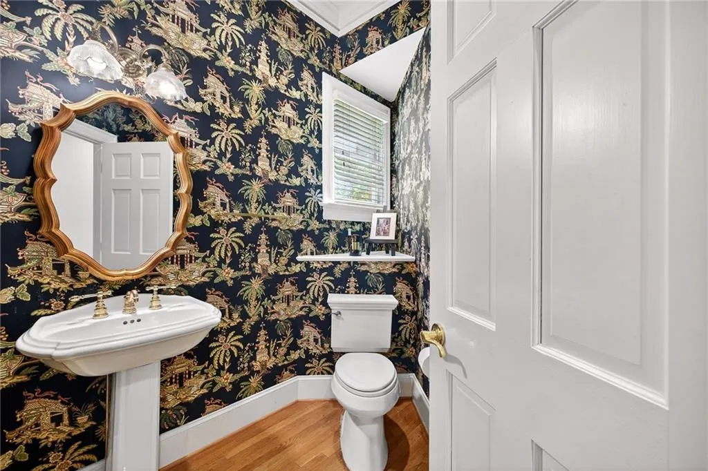 Powder bath on main is tucked away in hall for privacy
