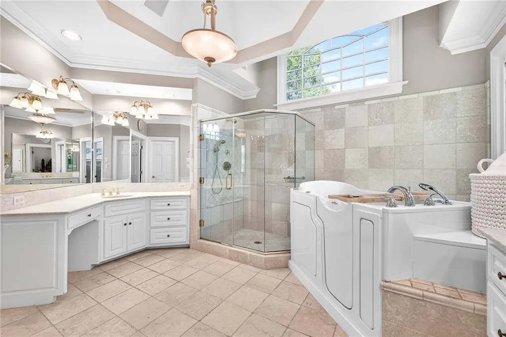Master bath with dual vanities, large shower and whirlpool tub