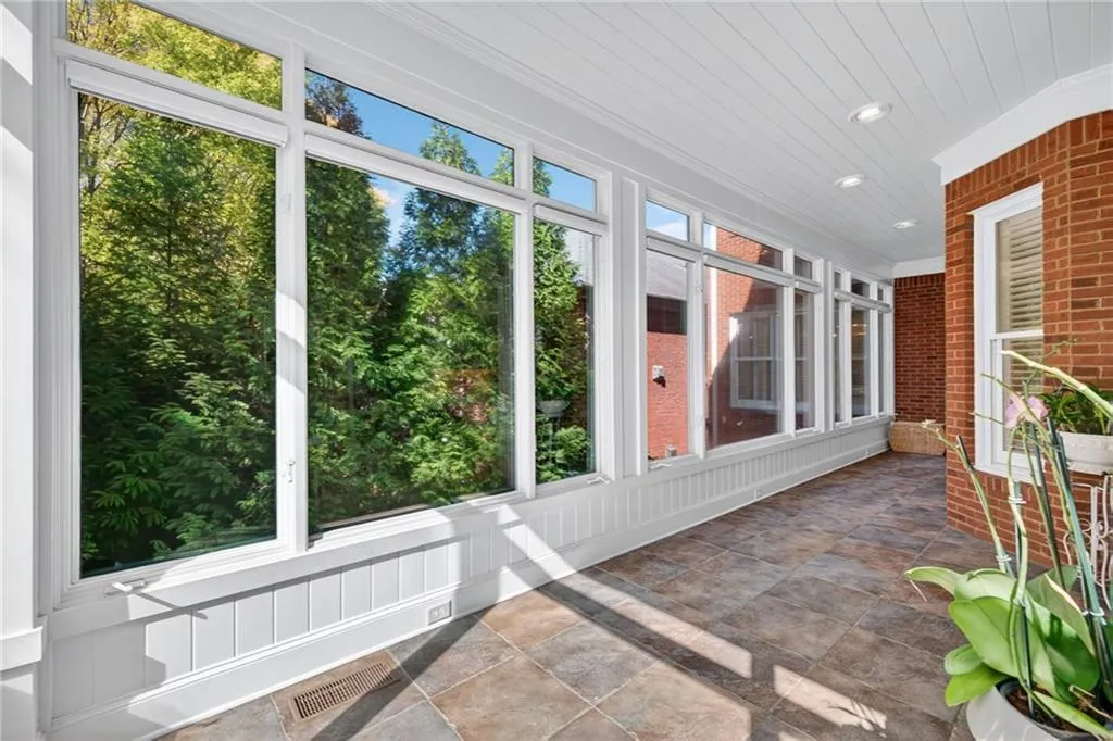 Large sunroom is perfect for sitting and enjoying a morning cup of coffee
