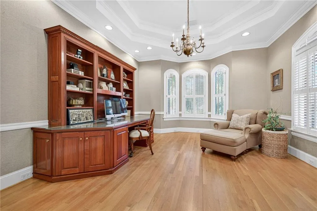 Home office with large built-ins and desk could also be a guest bedroom on the main