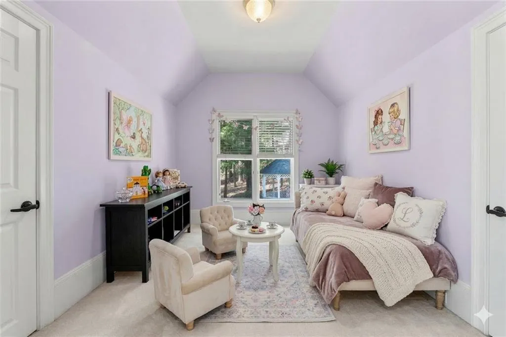 A charming play area just off the upper-level secondary bedroom provides a bright and inviting space for creativity and everyday fun.