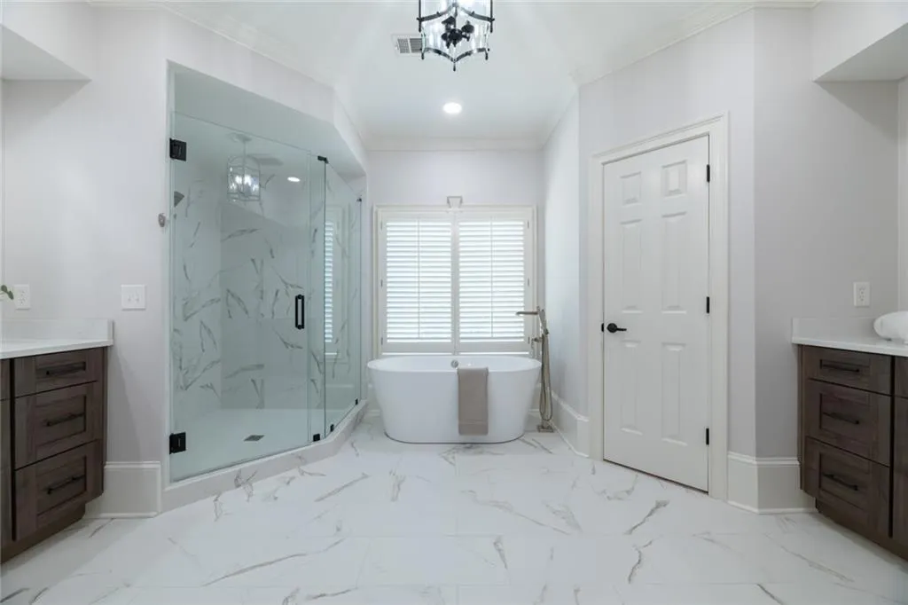 Remodeled spacious secondary primary ensuite offers ample room for a comfortable sitting area and additional furniture, creating a relaxing and versatile retreat.