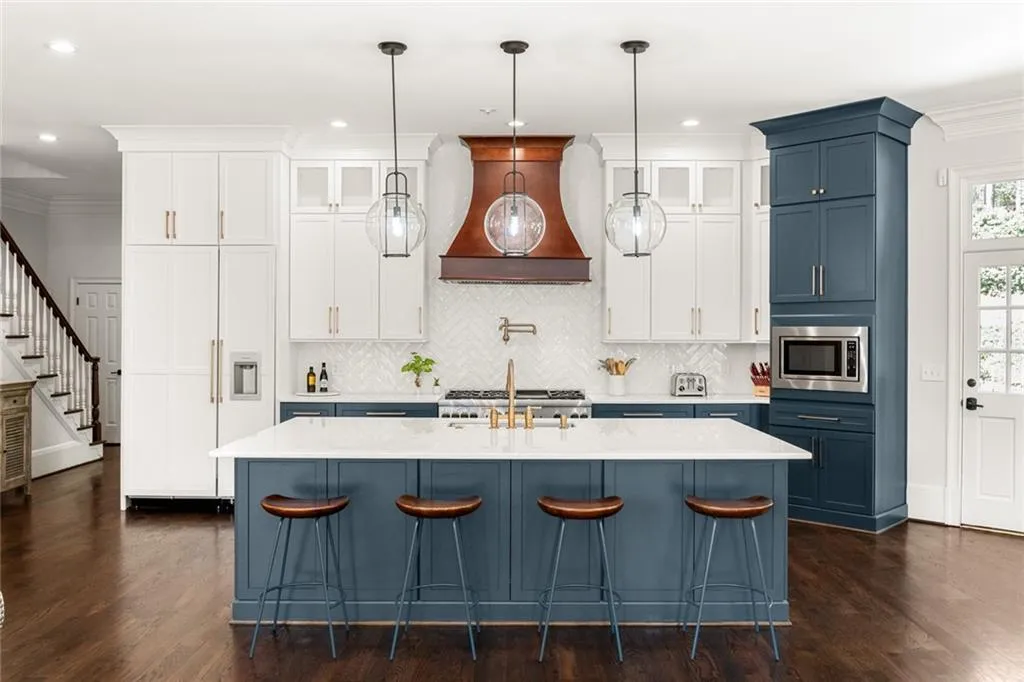 This beautifully designed kitchen with a spacious marble island and high-end finishes creates the perfect, ideal space for gathering, cooking, and entertaining.