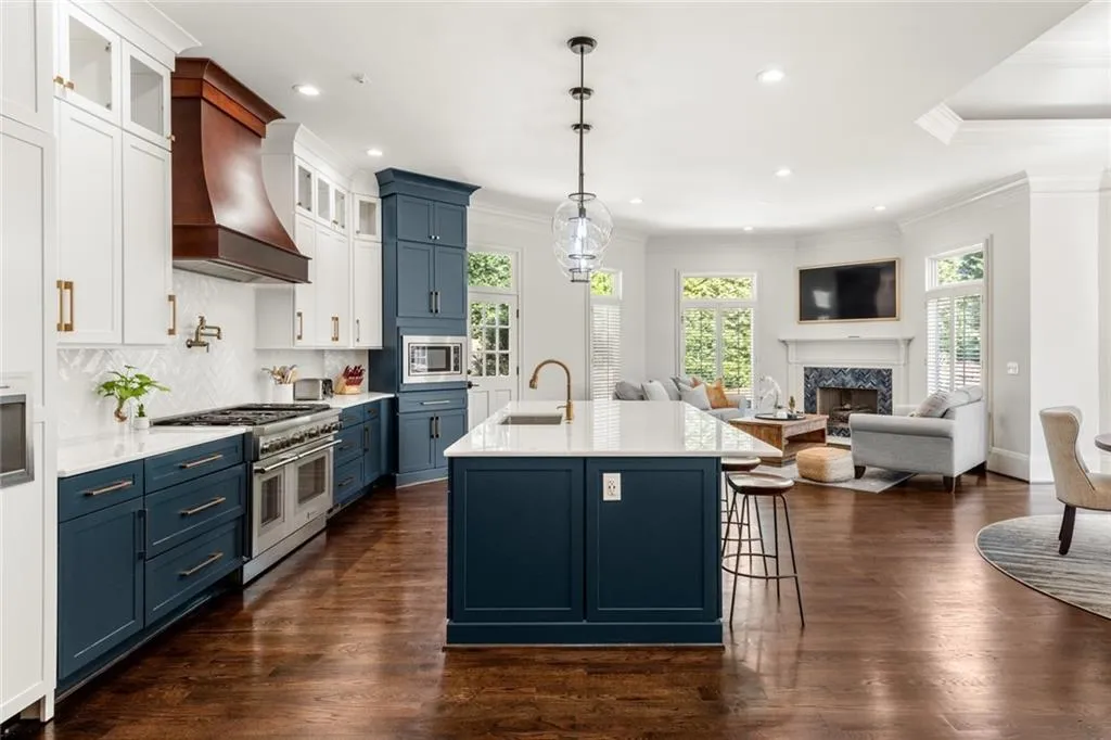 This stunning kitchen opens seamlessly to the keeping area, creating a bright and inviting space ideal for everyday living and entertaining. The open-concept design allows for effortless flow, with clear sight lines that keep everyone connected.