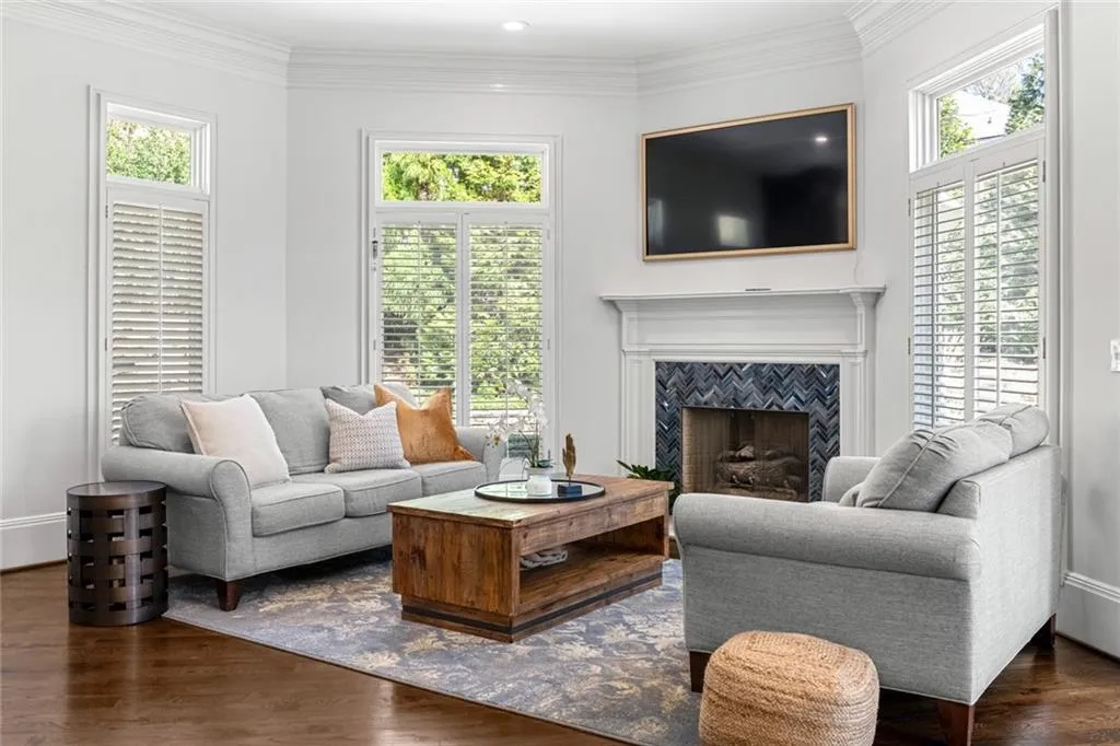 This inviting keeping room just off the kitchen features a cozy fireplace and abundant natural light, creating the perfect space for relaxed everyday living. Open and welcoming, it s ideal for gathering with family while staying connected to the heart of the home.