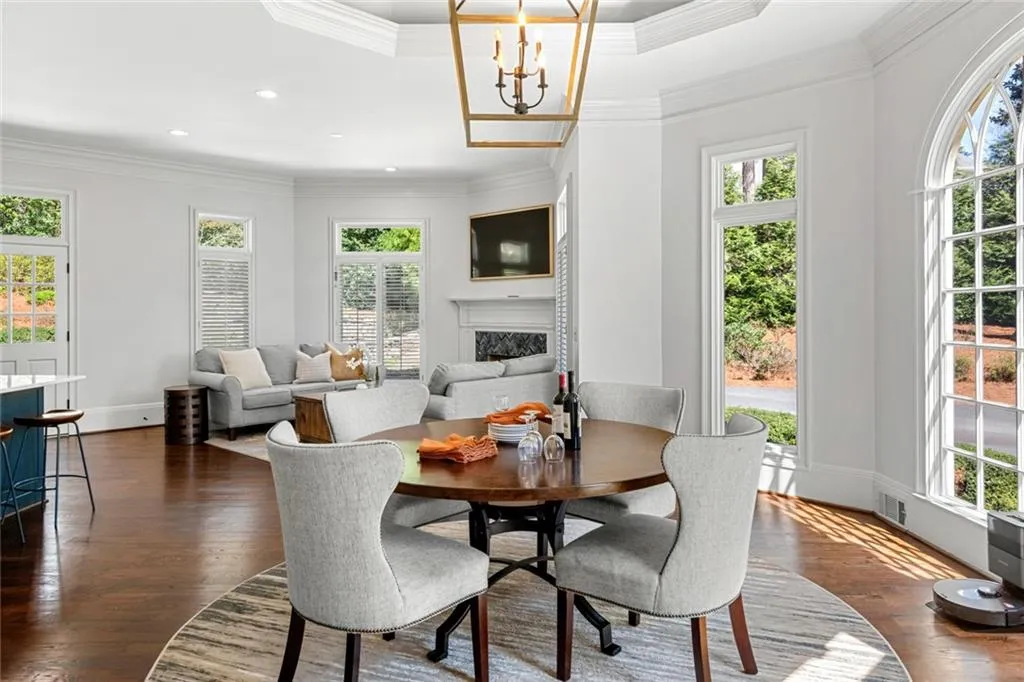 These casual living and dining areas just off the kitchen offer a bright, open space perfect for everyday meals and relaxed gatherings. Large windows and easy access to the outdoors create a seamless connection between indoor comfort and outdoor living.