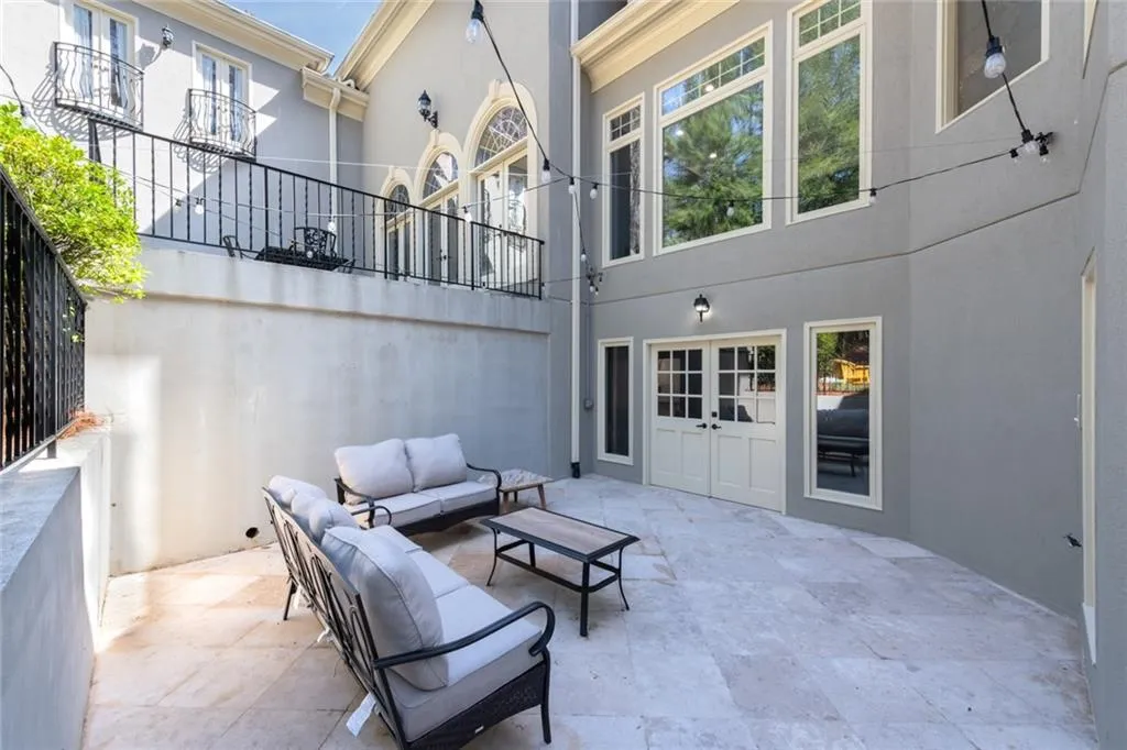 This private patio off the basement offers a peaceful outdoor retreat with direct access to the pool and backyard. Thoughtfully designed with ample seating space, it s perfect for relaxing or entertaining while enjoying the surrounding landscape.