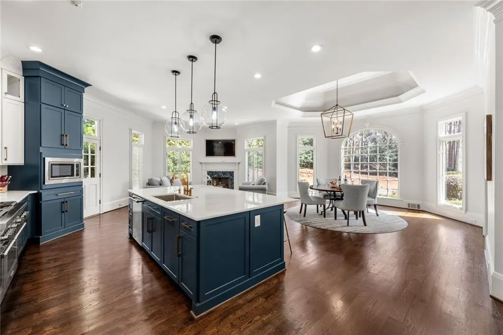 This beautifully designed kitchen offers an open view to the breakfast area and keeping room, creating a seamless flow for everyday living and entertaining. Bright and spacious, the layout allows natural light to fill the space while keeping everyone connected.